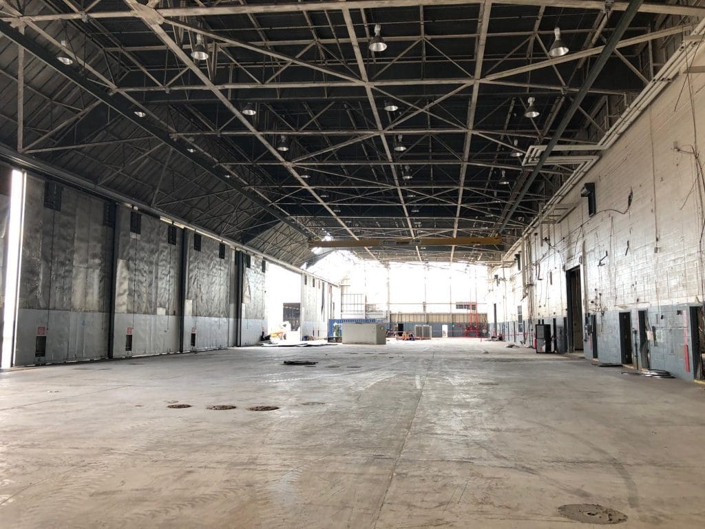 Empty hangar interior with a clear floor