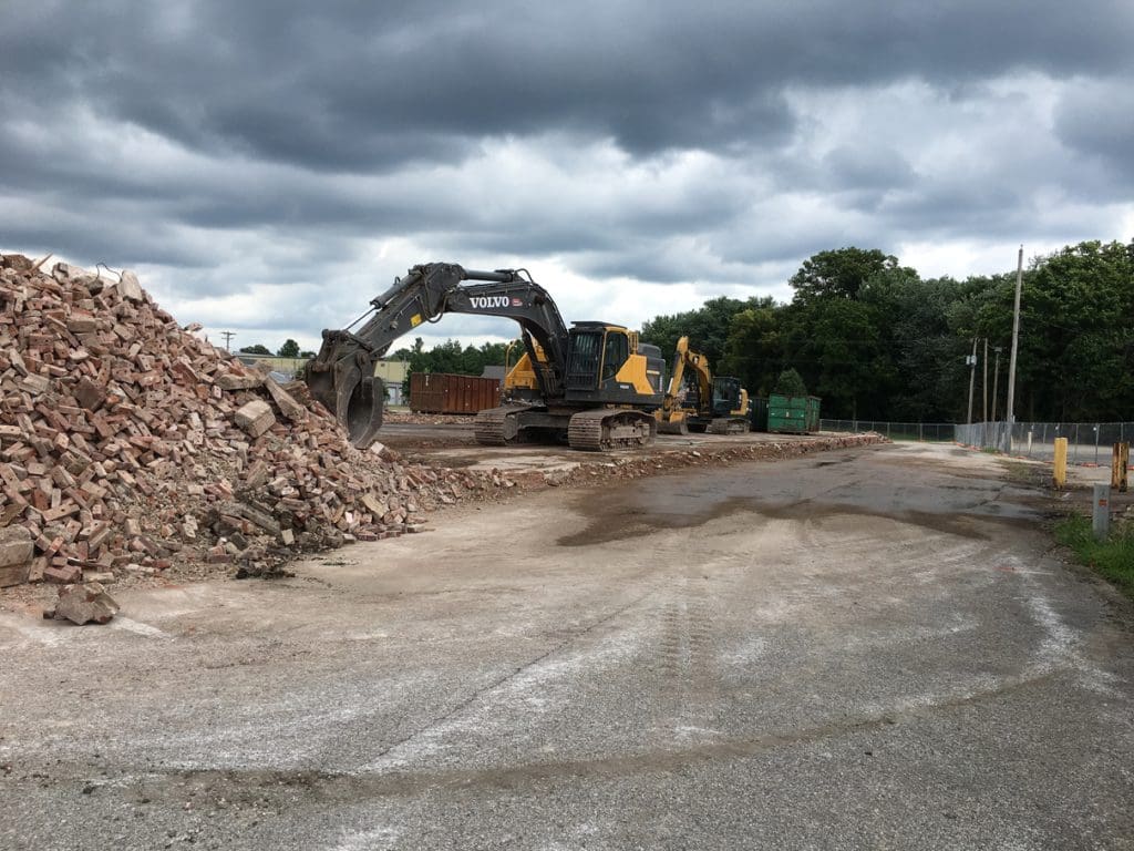 Graded ground with piles of crushed material