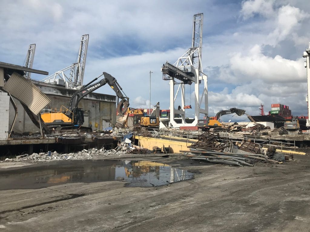 Excavators and cranes working across an industrial site