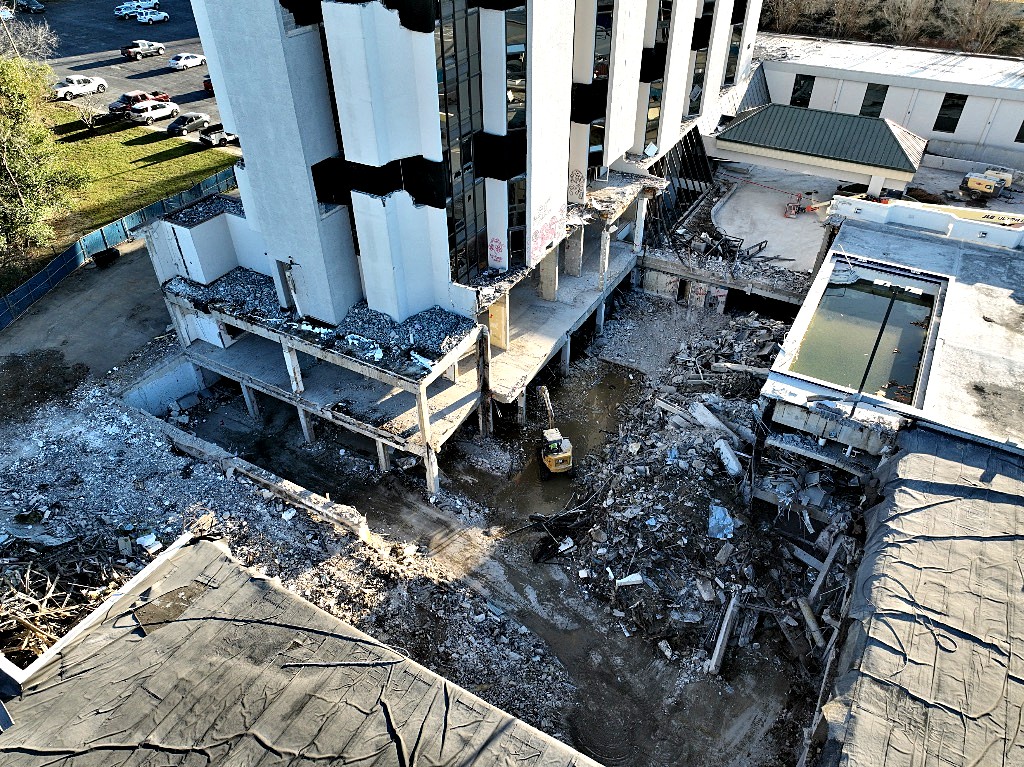 Aerial view of high-rise demolition and underground work