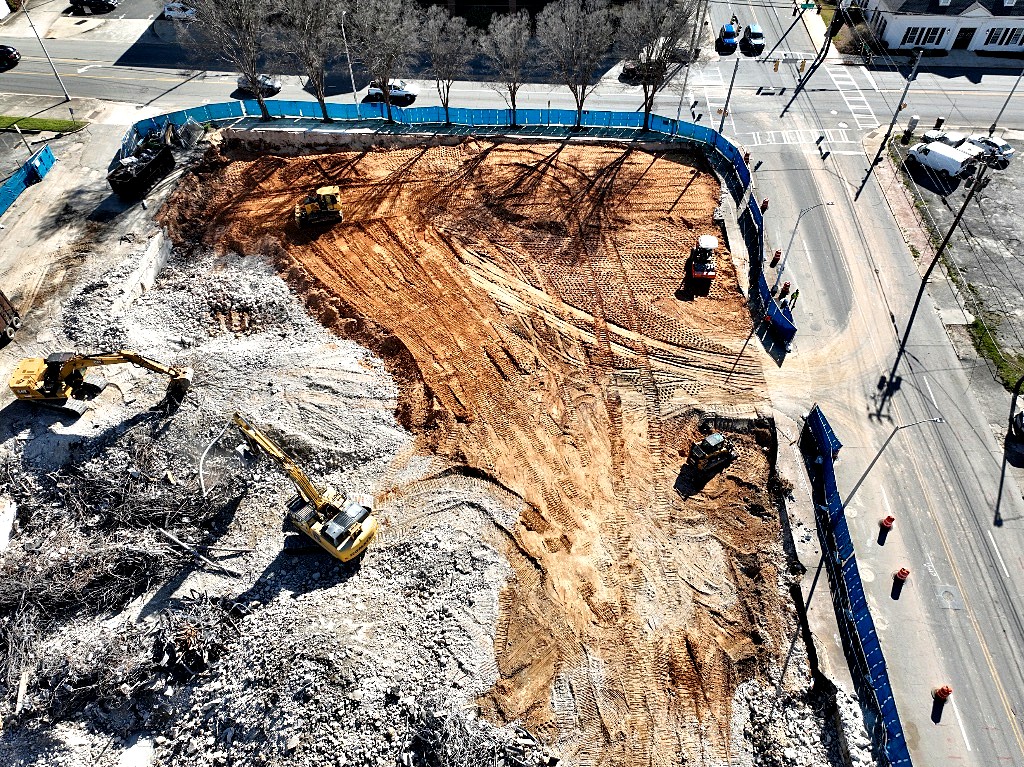 Aerial view of a cleared, graded site ready for the next phase