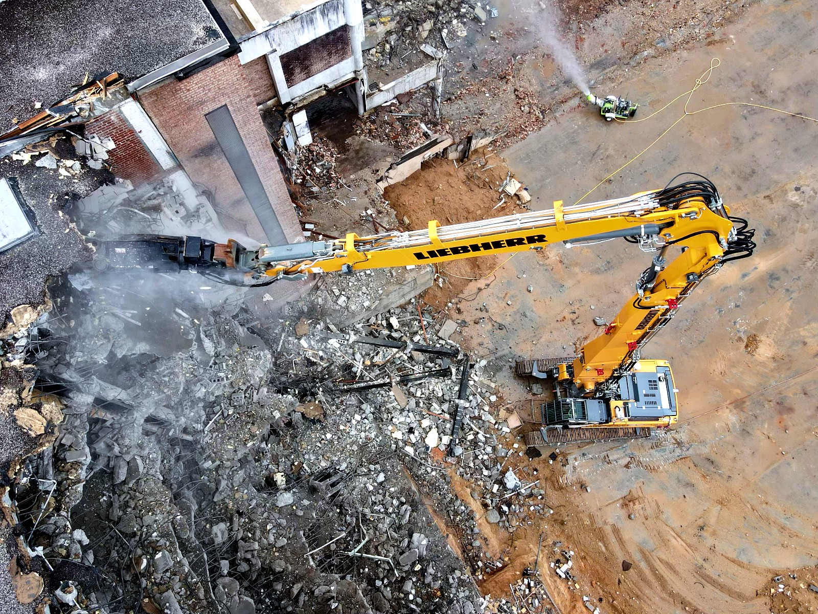 Long-reach excavator working on a demolition site